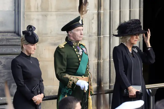 Sophie, the Countess of Wessex, and Camilla, Queen Consort, watched as the Queen's coffin was carried into the Cathedral