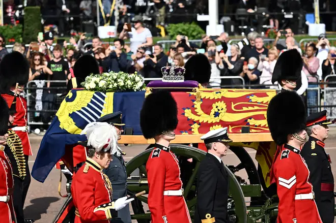 Members of the public watched as the Queen's final journey from Buckingham Palace took place