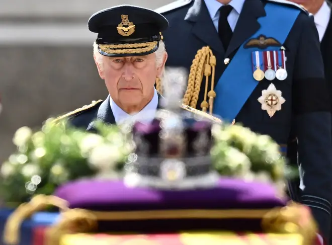 King Charles III looked sombre as he walked behind his mother's coffin