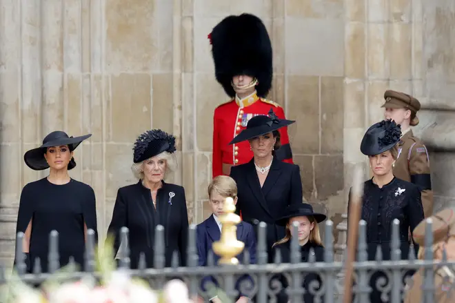 Catherine, the Duchess of Cambridge and Cornwall, stands with the Duchess of Sussex, Camilla the Queen Consort, Prince George, Princess Charlotte and Sophie Wessex at Westminster Abbey following the Queen's funeral