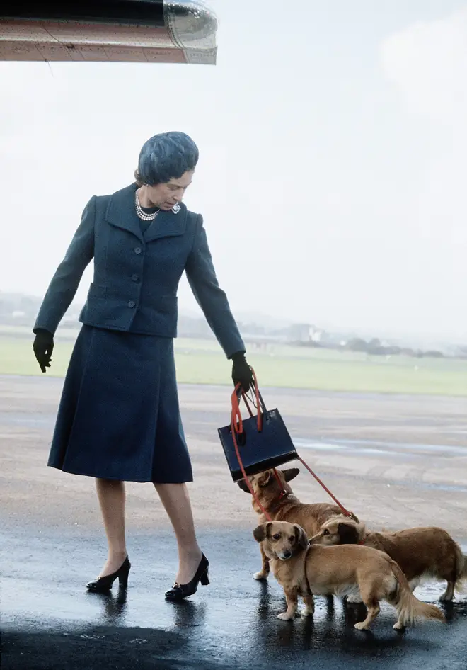 The Queen pictured in 1974 arriving at Aberdeen Airport for her summer break at Balmoral Castle with her corgis