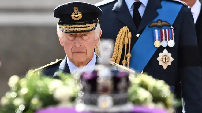 King Charles III walks behind Her Majesty Queen Elizabeth II's coffin during the state funeral