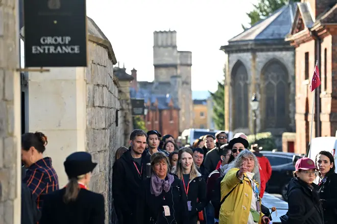 Members of the public queue outside Windsor Castle as it reopens to the public