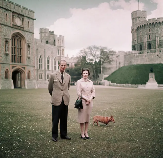 The Queen and Prince Philip at Windsor Castle with one of their corgis in 1959