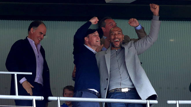 Prince William applauds at Aston Villa football match