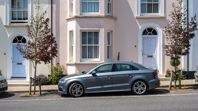A woman has said her neighbour won't let her park outside their house