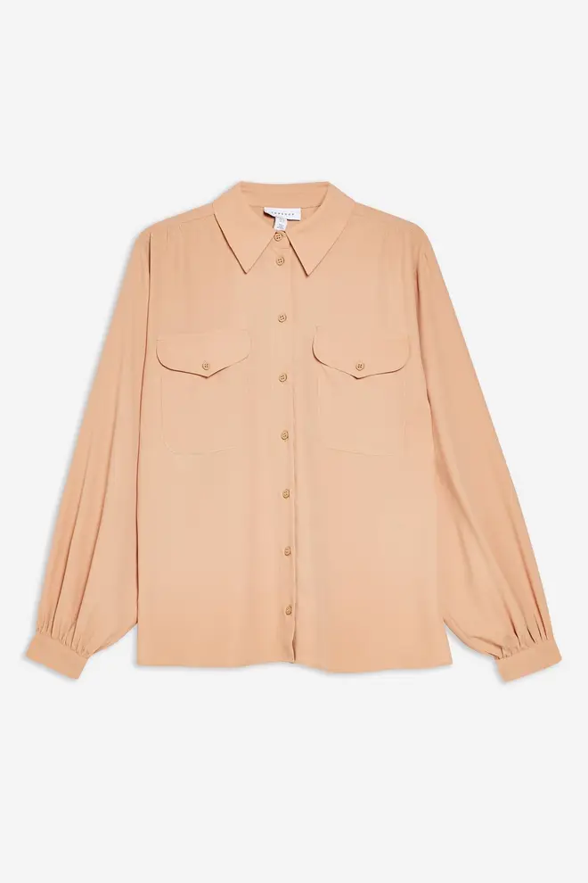Kelly's neutral-toned shirt is from Topshop
