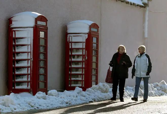 Snowy phone boxes in the Scottish Highlands