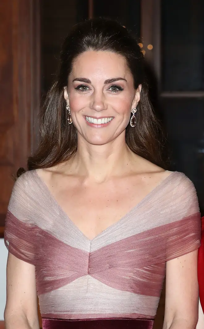 Kate Middleton wore her hair in a curl, with half pinned up