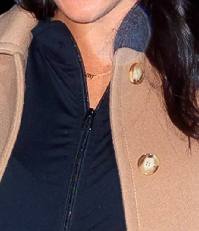 The "mommy" necklace could be seen under the Duchess of Sussex&squot;s jacket