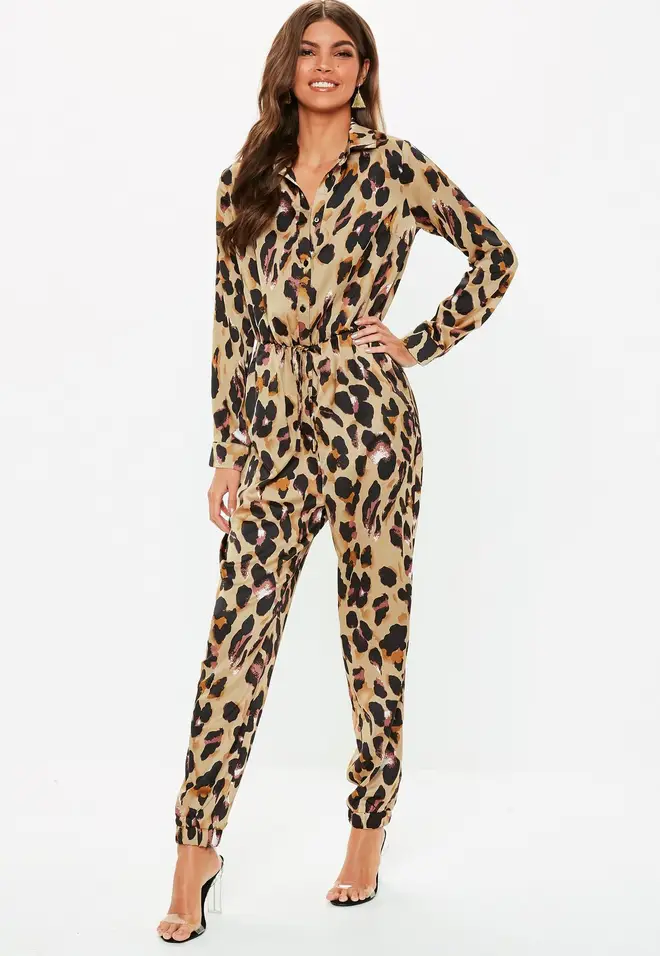 As Kim Kardashian steps out in a leopard print catsuit at PFW, we ...