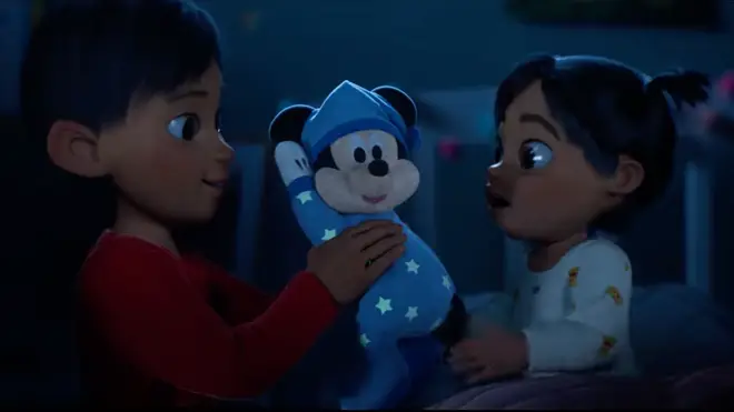Max gives Ella his Mickey Mouse toy to help her sleep in one of the sweet advert scenes