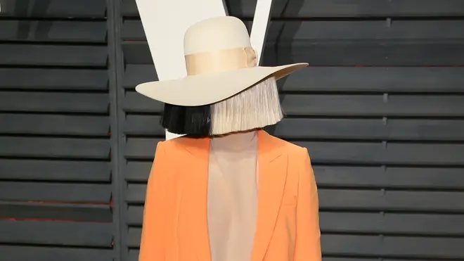Sia usually covers her face while attending red carpet events