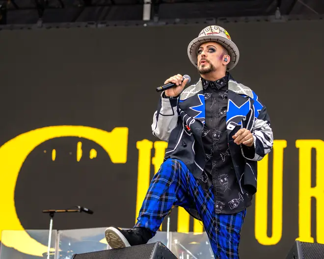 Boy George performing at a festival in 2022