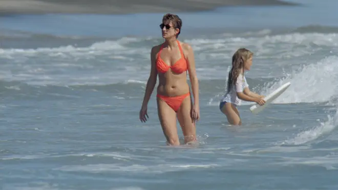 Princess Diana showed off her amazing figure in an orange bikini