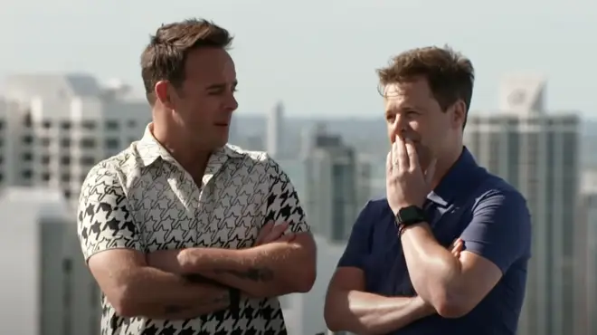 Ant and Dec attempt to encourage Babatúndé to walk along the plank during the challenge