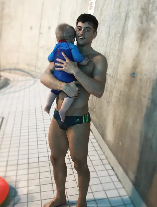 Tom has already taken little Robbie swimming