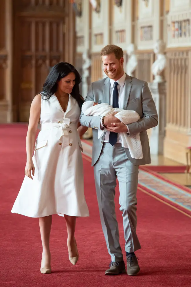 The royal couple beamed as they looked at their son