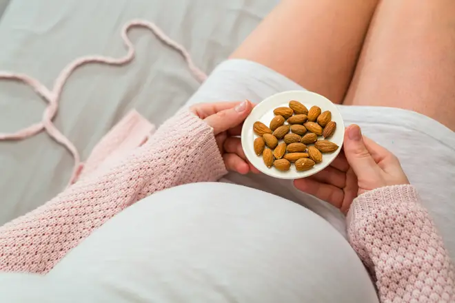 The folic and fatty acids found in nuts are said to boost brain development in children (stock image)