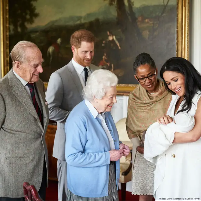 The Queen, Prince Philip and Doria Ragland look lovingly at the newborn