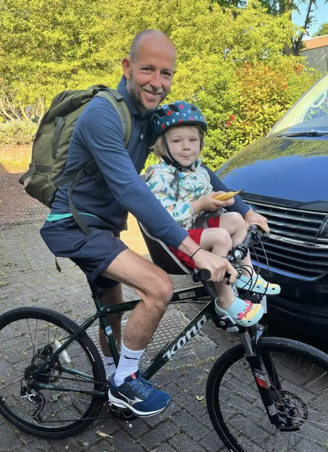 A Place in The Sun's Jonnie Irwin and his son on a bike