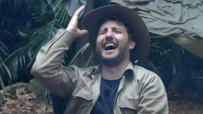 Seann Walsh laughs as Mike Tindall tells his embarrassing story in the I'm A Celebrity camp
