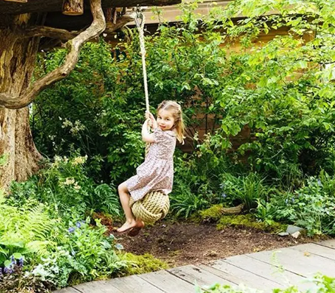 Princess Charlotte enjoyed a swing on the rope in the woodland park