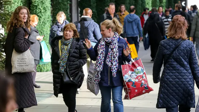 Two women doing their Christmas shopping in the UK 2022