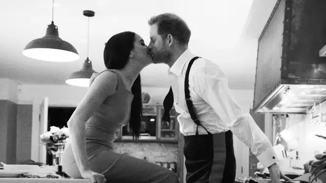 Meghan Markle and Prince Harry share a sweet kiss in a still taken from the trailer of their upcoming Netflix series