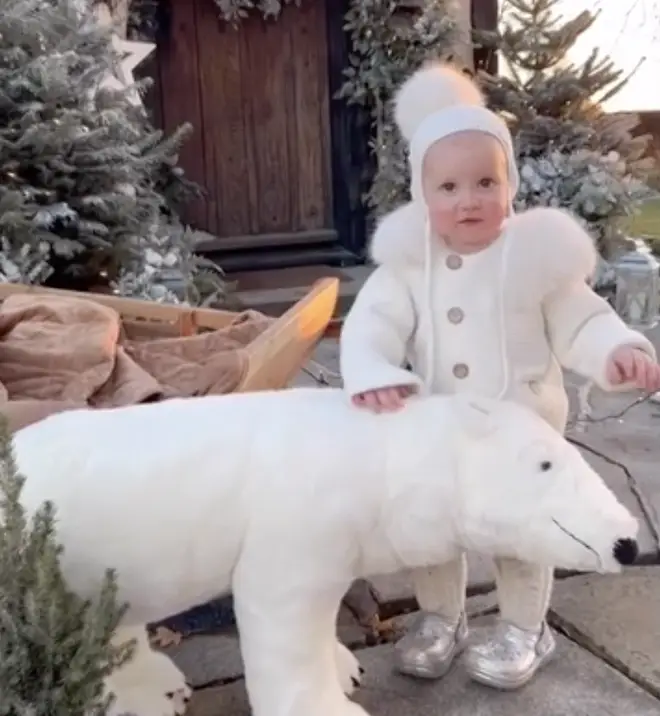 One-year-old Rose petted Pickle Cottage's resident polar bear.