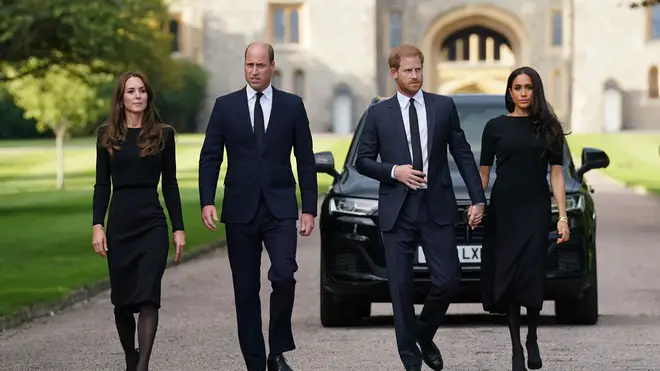 The Prince and Princess of Wales and the Duke and Duchess of Sussex walk towards the gates of Windsor Castle to view messages from the public following the Queen's death