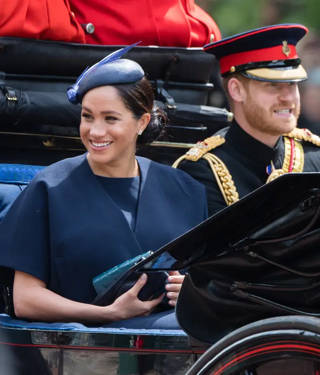 Meghan Markle opted for a matching navy short sleeve dress and wrap jacket by Givenchy for Trooping the Colour.