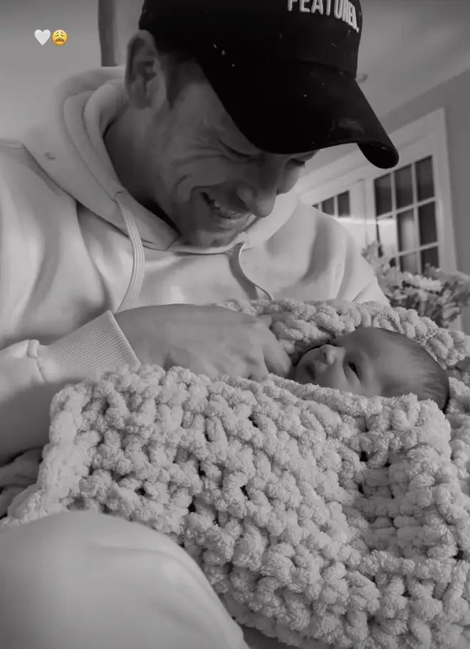 Joe Swash looks obsessed as he holds his newborn daughter Belle
