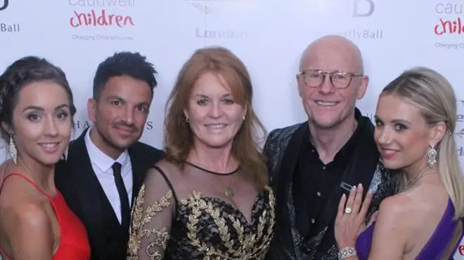 Founder John Caudwell poses with stars, including the Duchess and Peter Andre, at the charity event