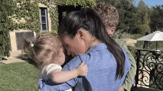 Meghan Markle hugging children Archie and Lilibet