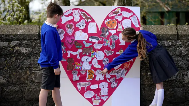 Pupils from Aldington Primary School created picture collages of their drawings of dogs along the route of the funeral