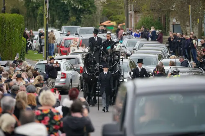 The funeral cortege of Paul O'Grady travels through the village of Aldington