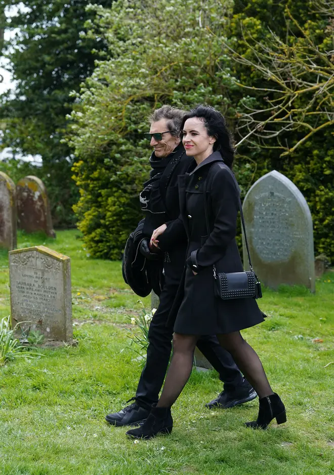 Ronnie and Sally Wood arrive at the church for the funeral of Paul O'Grady