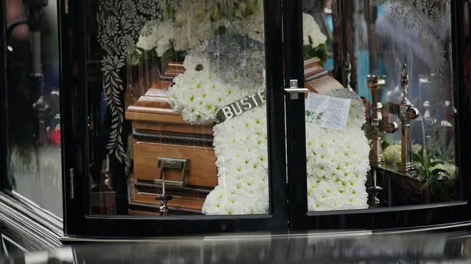 A floral tribute of Buster could be seen laying on Paul O'Grady's coffin