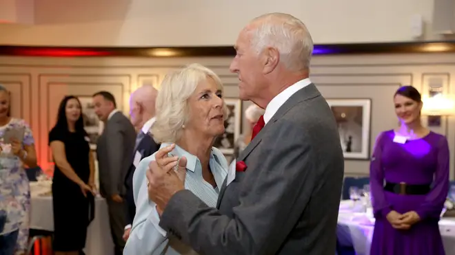 Len Goodman dances with the Queen Consort at The Victory Services Club, 2019