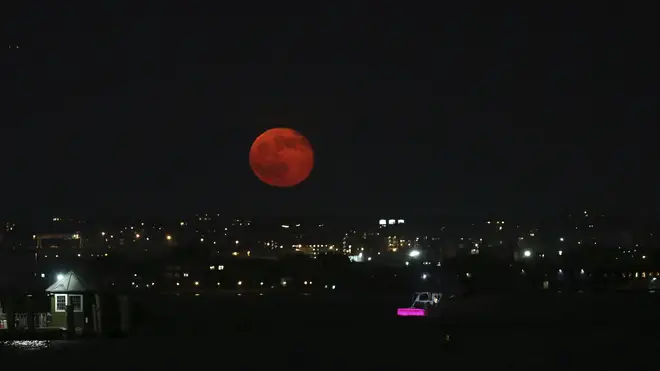 The New York City skyline got an impressive view of the Strawberry Moon