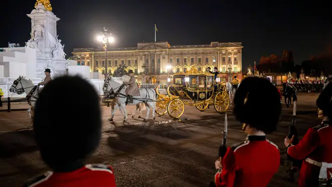 The Diamond Jubilee State Coach is led in a procession as it leaves Buckingham Palace during a rehearsal for the coronation of King Charles III