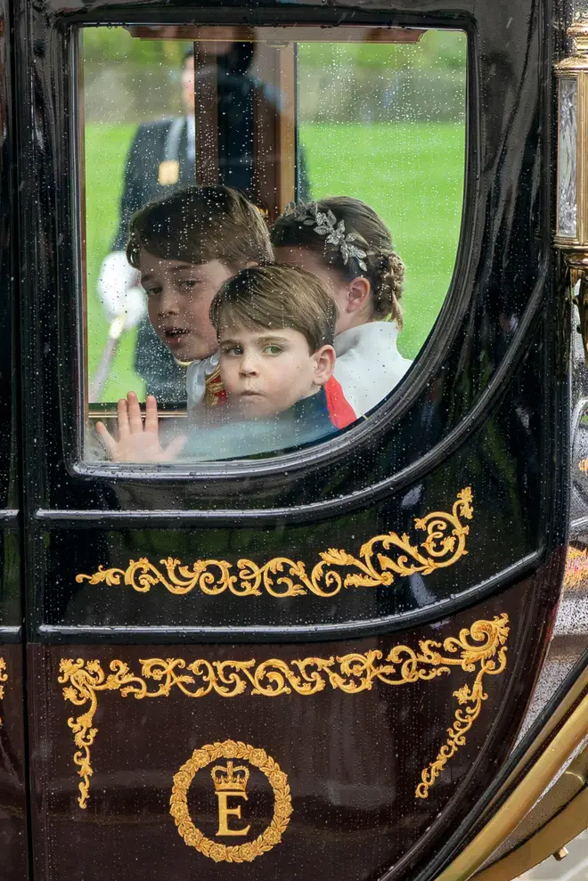 Princess Charlotte, Prince George and Prince Louis as the Coronation Procession leaves Westminster Abbey