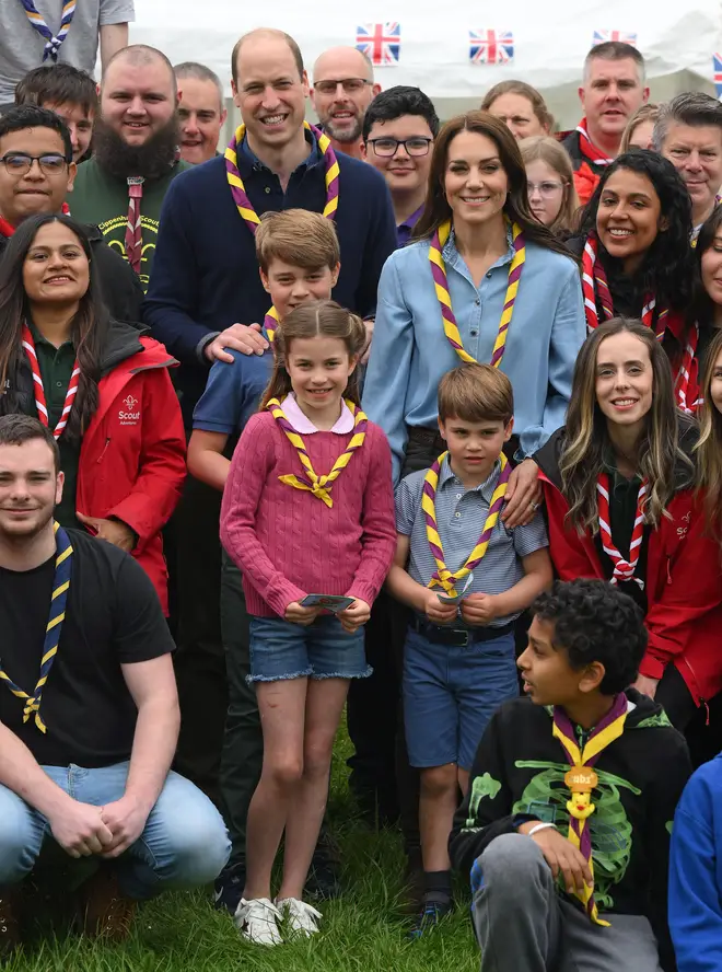The Prince of Wales, Princess of Wales, Prince George, Princess Charlotte and Prince Louis pose with volunteers after helping to renovate and improve the 3rd Upton Scouts Hut in Slough