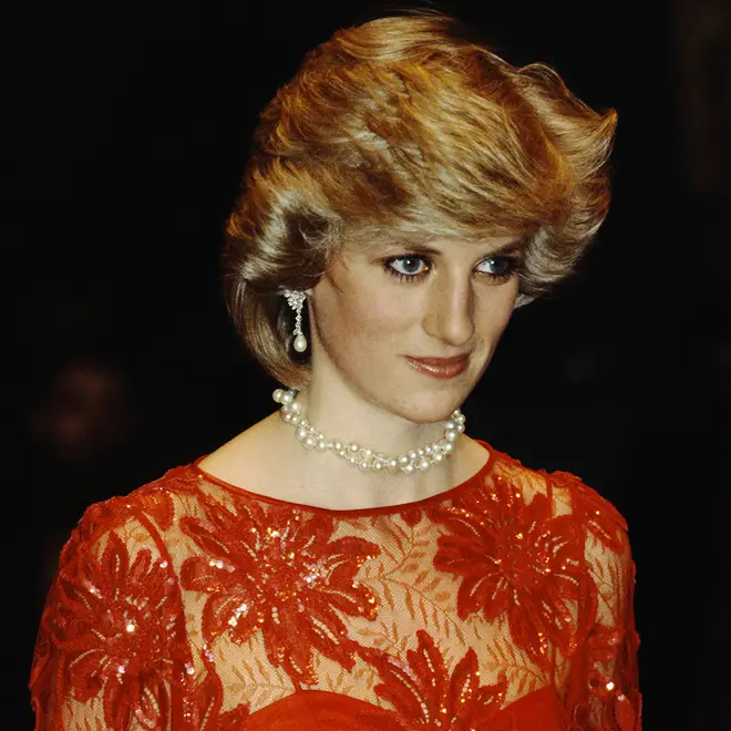 Princess Diana wearing her diamond and pearl earrings with a matching necklace and red dress