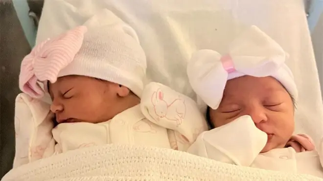 Dani Dyer shares pictures of her twin girls from their hospital bed wearing bow hats and tucked into a blanket
