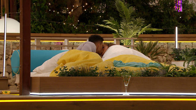 Michael and Amber shared their first kiss on the bed outdoors
