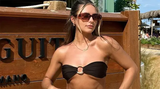 Leah Taylor wearing a black bikini while on holiday in Dubai