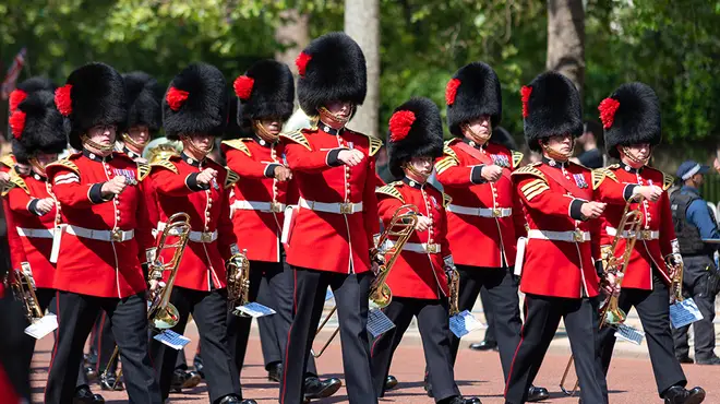 Royal guards in bearskin hats marching