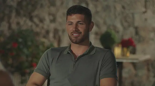 Scott Van Der Sluis wearing a grey polo top on a night date on Love Island